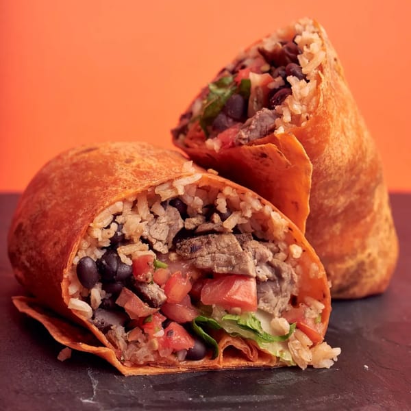 Two 360 Gourmet Burritos, one cut open to show rice, beans, meat, tomatoes, and lettuce.